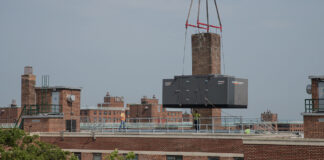 Generator being lifted into place