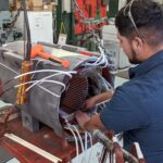 Motor specialists rewinding a motor