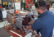Motor specialists rewinding a motor